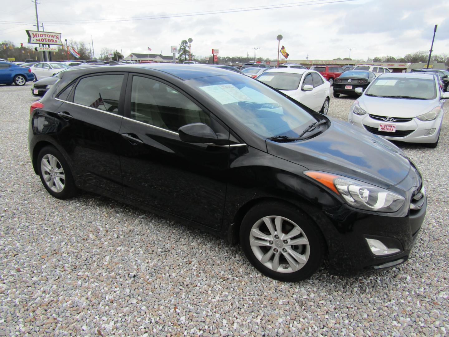 2013 Black Hyundai Elantra GT A/T (KMHD35LE1DU) with an 1.8L L4 16V DOHC engine, 6-Speed Automatic transmission, located at 15016 S Hwy 231, Midland City, AL, 36350, (334) 983-3001, 31.306210, -85.495277 - Photo#0